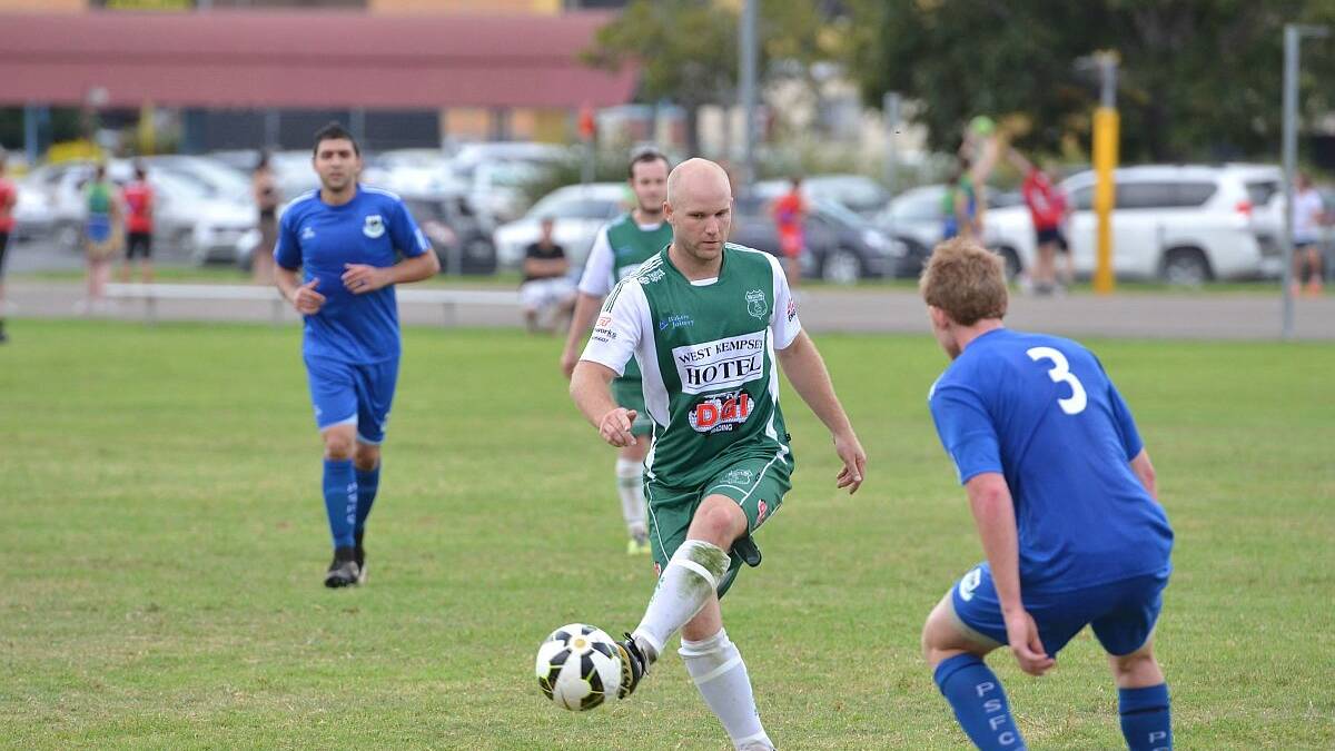 Moving the ball forward: Adam Stutz from the Kempsey Saints passes the ball during his side’s match against the Port Saints on Saturday. Kempsey ended up losing the match 5-3. Photo: Penny Tamblyn.