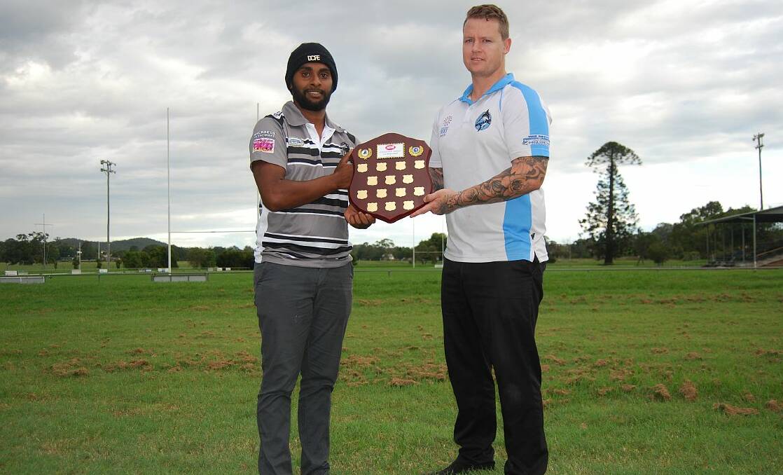 Local derby: Jamahl Toby from the Lower Macleay Magpies and Tony Duncan from the South West Rocks Marlins with the West IGA Charity Shield which will be awarded to the winner of the Hastings League clash on Sunday.