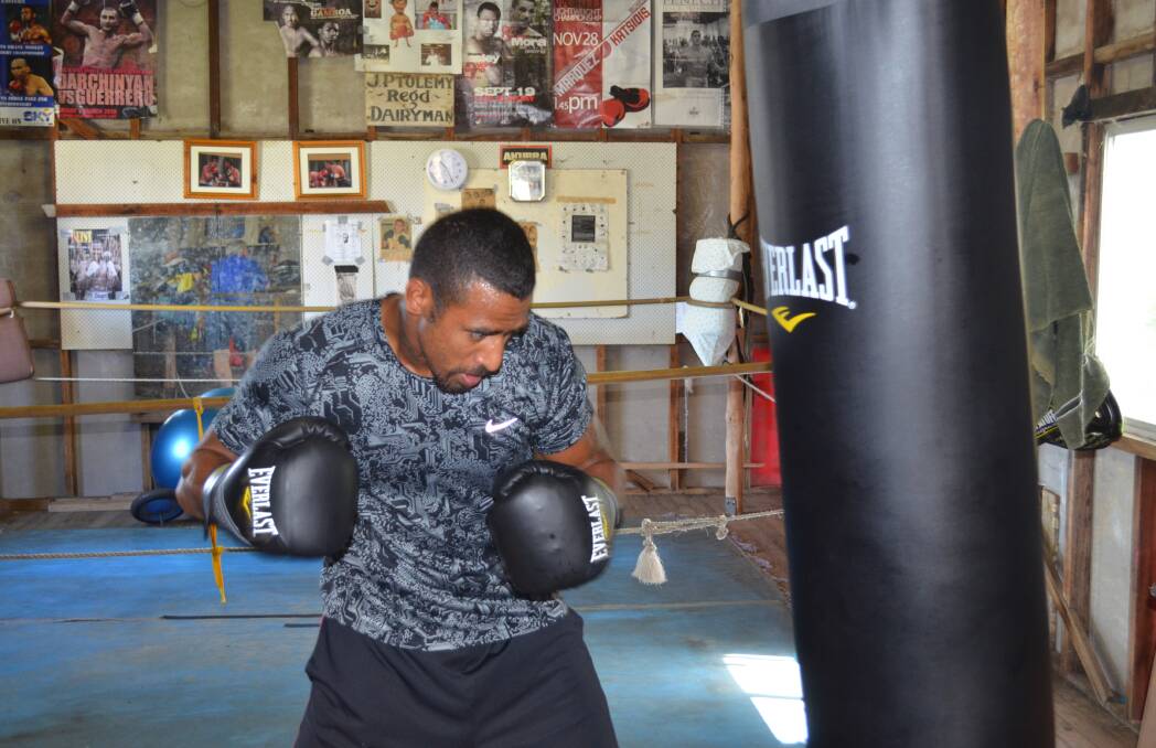 Renold Quinlan trains with a punching bag in the lead up to his title defence with Chris Eubank Junior.