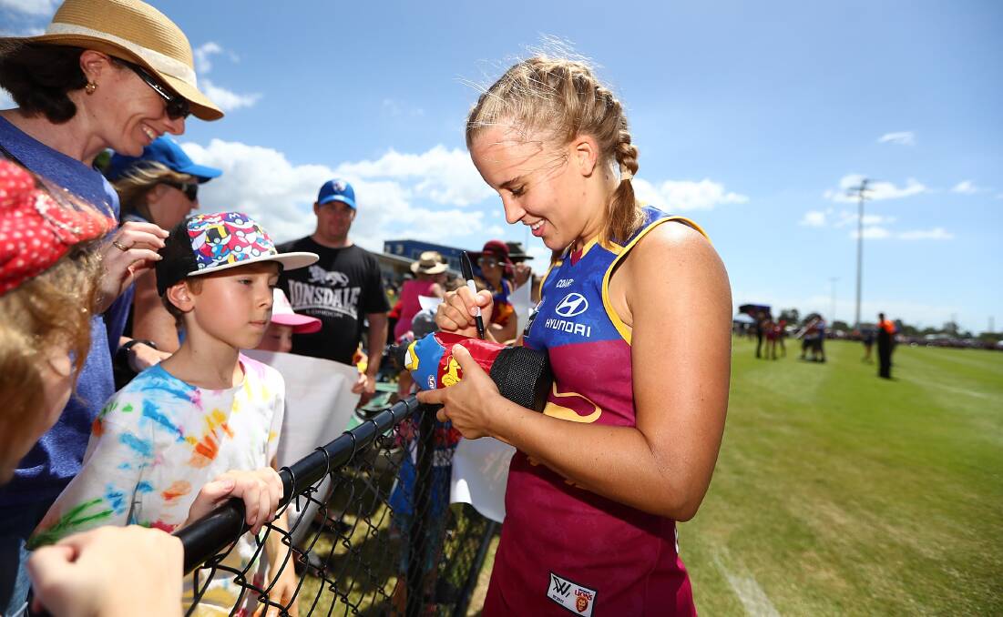 Star struck: North Coast athlete Nikki Wallace signs autographs and will represent the Brisbane Lions in the inaugural AFL Women's grand final this Saturday. Photo: AFL Photos.