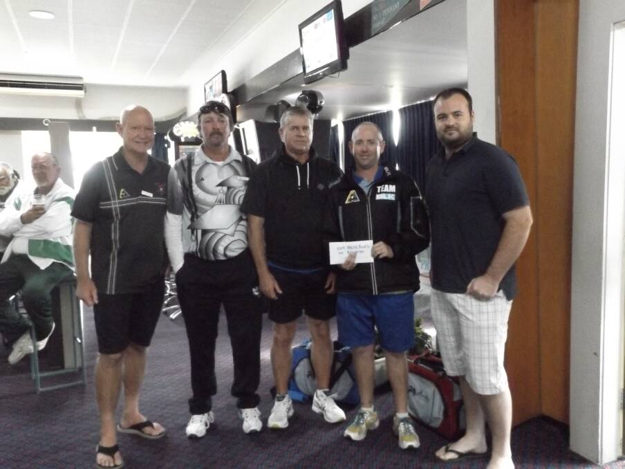 Nick Dyet (right) presenting Team “X” with their prize money as the winners of the annual KALITE Fours bowls tournament.