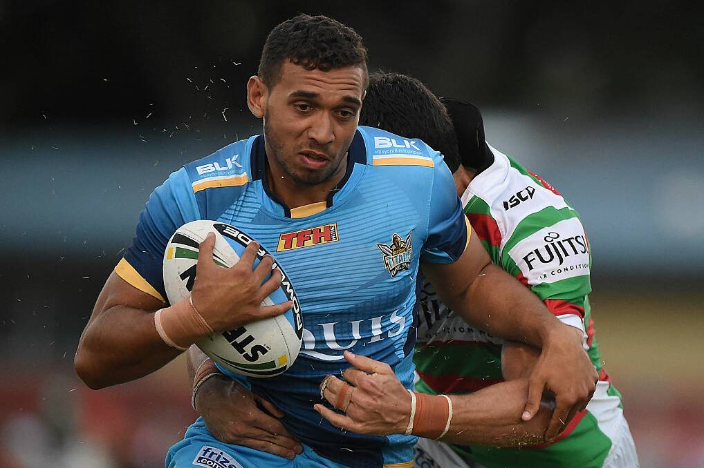 Tyrone Roberts-Davis of the Titans is tackled during the NRL trial match between the Gold Coast Titans and the South Sydney Rabbitohs at Pizzey Park on February 20, 2016 on the Gold Coast, Australia. (Photo by Matt Roberts/Getty Images)