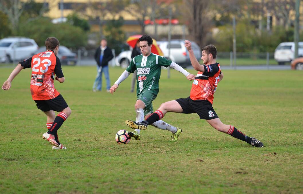 Kempsey Saints player Tristan Smith looks to avoid a Camden Haven defender.