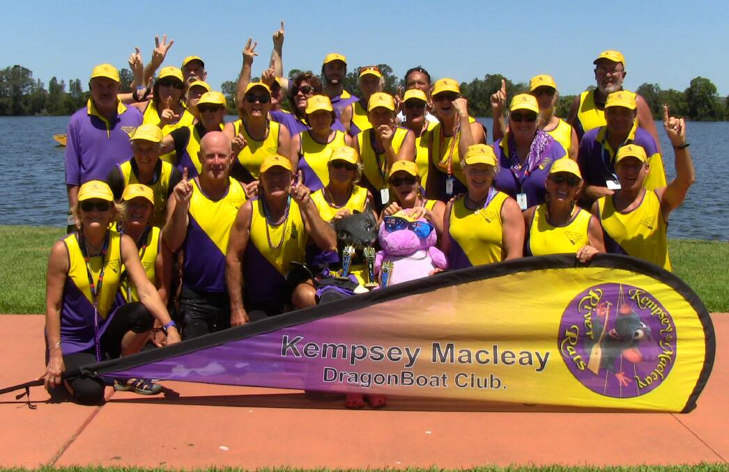 The Kempsey Macleay Dragon Boat Club members celebrating after their victories at the Taree Regatta.