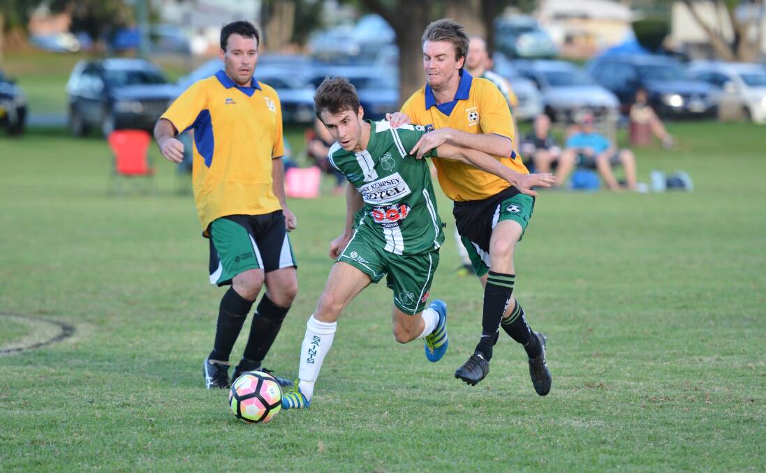 Successful start: Kempsey Saints' Nick Wright holds off a defender during his side's victory on Saturday. Photo: Penny Tamblyn.