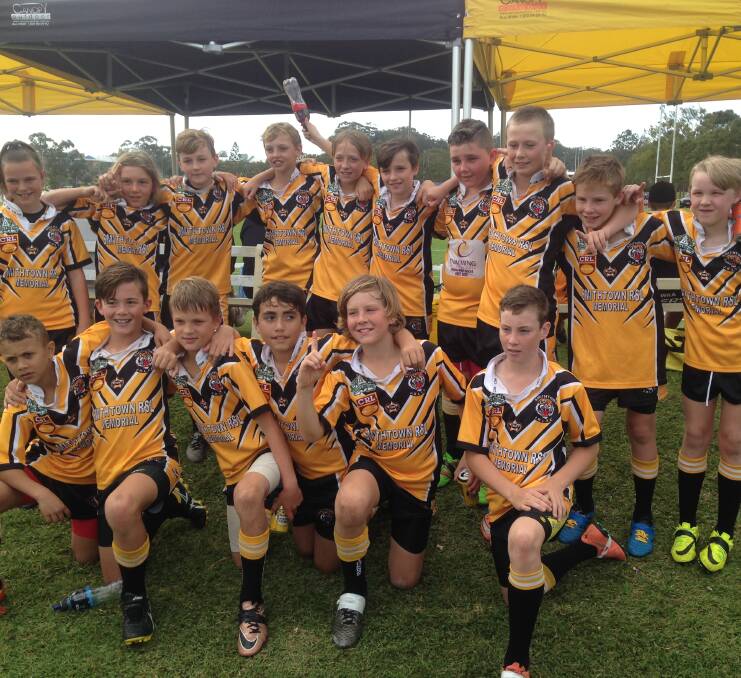 Premiership celebrations:  The Smithtown Tigers Under 11's side celebrates after defeating Coffs Harbour in the grand final decider 24-12.