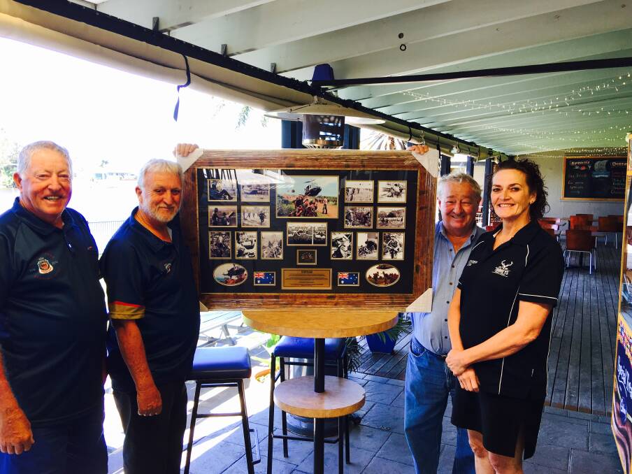 Smithtown Riverview Hotel Licence Manager Tanya Maddelena and Proprietor John Anderson present SWR RSL Sub-Branch Senior VP Paul Huggins and Committee member Dick McLoughlin with the donated Anzac Day prize.