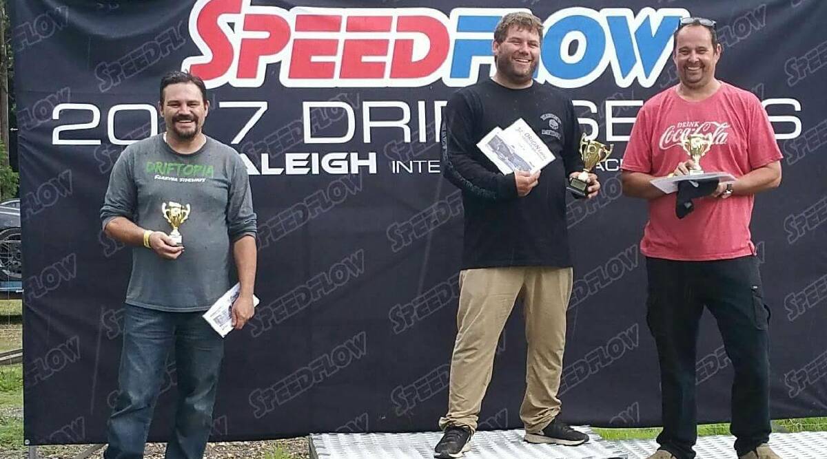 Mat Huxley claims his first place prize after the opening round of the Speedflow Drift Series Australia.