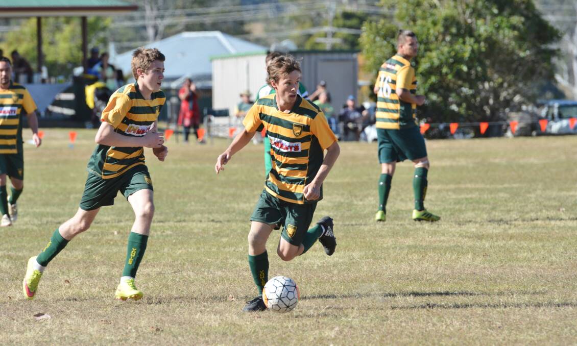 Vision: Upper Macleay Yowies player Paddy Dixon looks forward in attack with the ball at his feet. Photo: Penny Tamblyn.