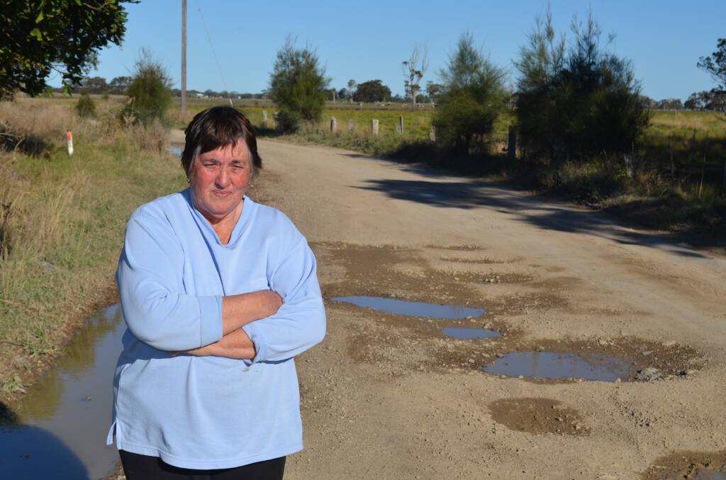 Fed up: Margaret Campbell was sick of the state of Suez and Rainbow Reach roads which were covered in potholes near South West Rocks. Photo: Callum McGregor.