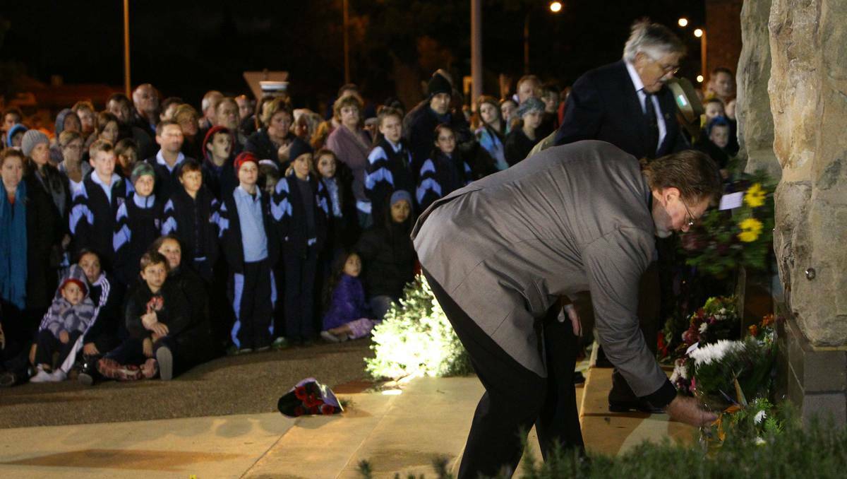 Thousands paid tribute to the Anzacs at the Wollongong dawn service. Photo: KEN ROBERTSON