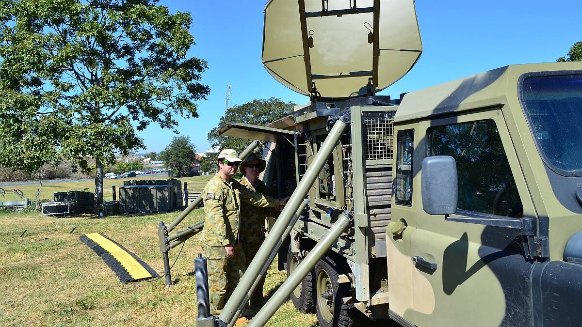 Roger wilco: LAC Javid Bing and Corporal Paul Savage-Wroth from 3CRU with some of the RAAF communication equipment deployed at Kempsey Showground.