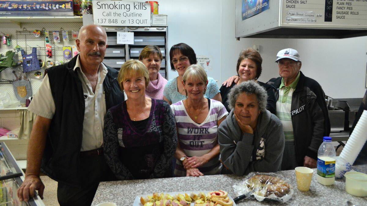 Moving on: Ruth and Michael Worthing are shutting their convenience store in Middleton St after 26 years in business. Pictured are Michael Worthing, Ruth Worthing, staff members Cheryl Askew, Rowena Worthing, Maureen Fitton, Kathy Lang and customers Nita Davis (front) and Lloyd Dufty. Not pictured is staff member Diane Batterson
