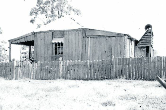 Pioneer home: This old slab cottage at Mungay Creek had a shingle roof, replaced with iron. It was built by an early settler going by the name of Cavanagh. The fence is wooden paling. The photo is printed from the Macleay Argus negative collection and dates from 1962. Pics: Macleay River Historical Society.