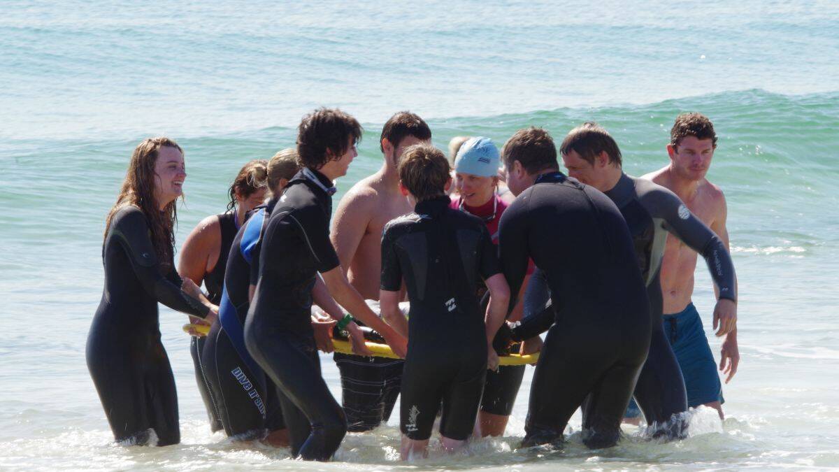 Special skills: surf life savers at the South West Rocks club learn how to rescue a swimmer with a spinal injury as part of their bronze medallion training. Surf clubs will welcome new members.
