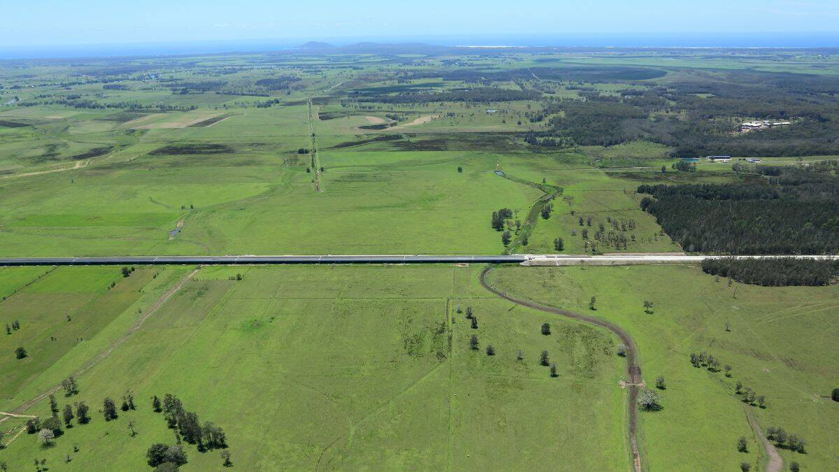 Historical moment: the longest bridge in Australia crosses the magnificent Macleay floodplain, with the coast in the background. The bridge and bypass are part of the Pacific Hwy upgrade. 