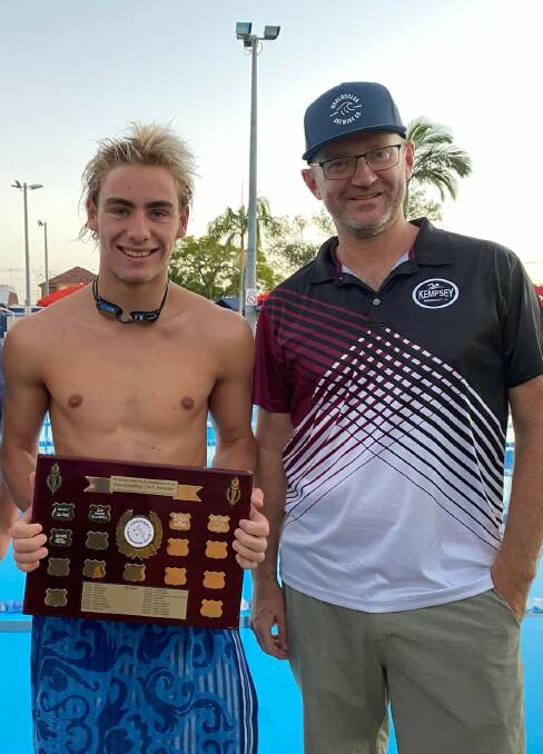 Max Farrell from the Kempsey Swimming Club with the club president Tim Smith. Photo supplied