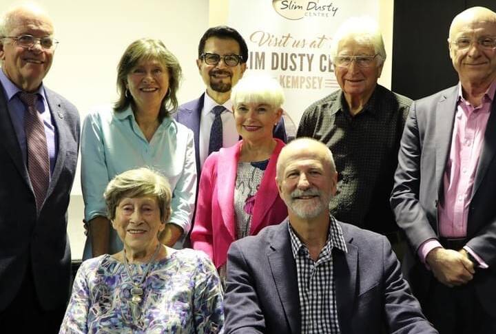 Joy McKean (bottom left) with her family and council representatives, at the handover to the community of the Slim Dusty Centre. Picture from the Slim Dusty Centre