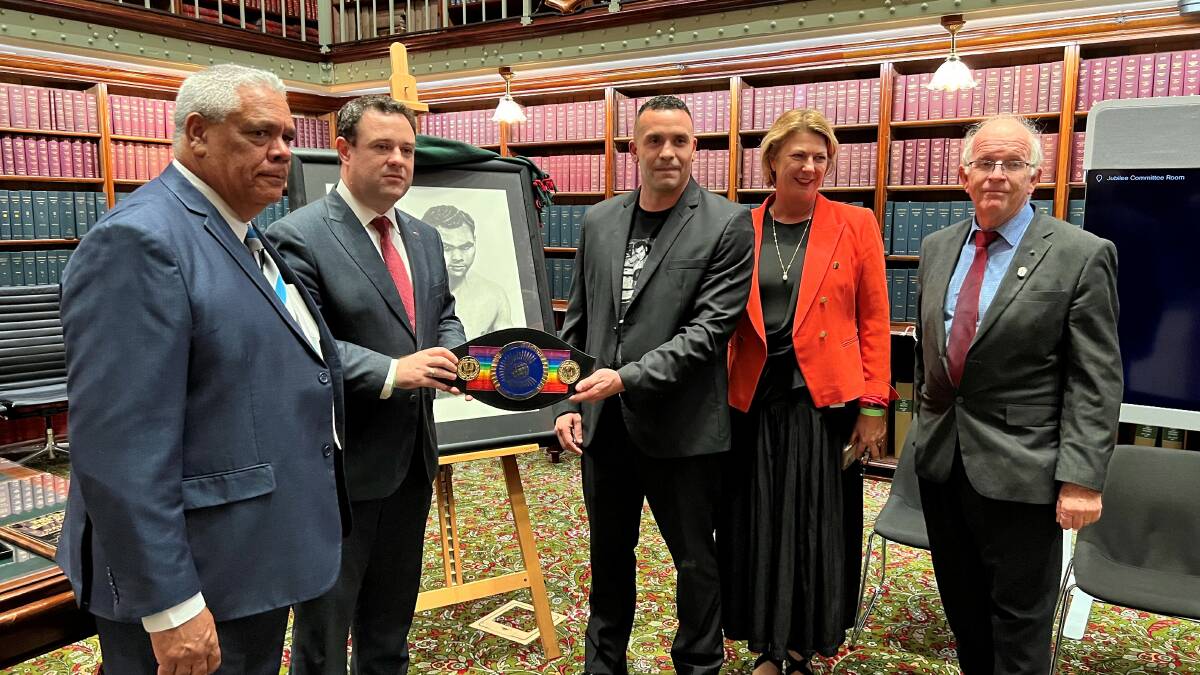 The Ritchie family being presented with a replica of Dave Sands' championship belt at NSW Parliament House. From left, Phil Dotti, NSW Sports Minister Stuart Ayres, Chad Ritchie, Oxley MP Melinda Pavey and Kempsey Mayor Leo Hauville.
Photo: Lachlan Harper