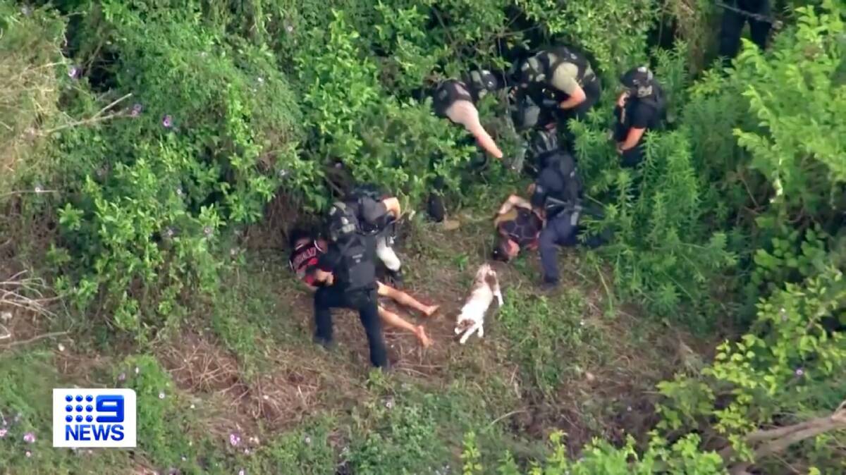 The men were arrested in bushland on the Kempsey riverbank. Picture from Nine News.