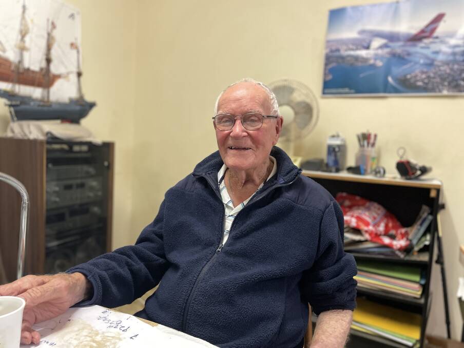 101 year old Burt Rixon lives alone in his South West Rocks home surrounded by photos of his family and aircraft memorabilia. Picture by Ellie Chamberlain