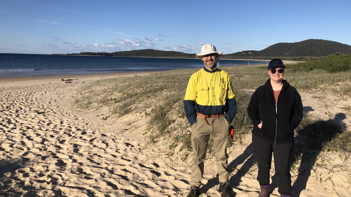 SWR Community Dune Care President Ian Burnett with Sara Ormond from the NSW Environmental Trust. A new grant will increase the resilience and protect littoral rainforest along 4.75km of coastal dunes at Trial Bay. Photo: supplied