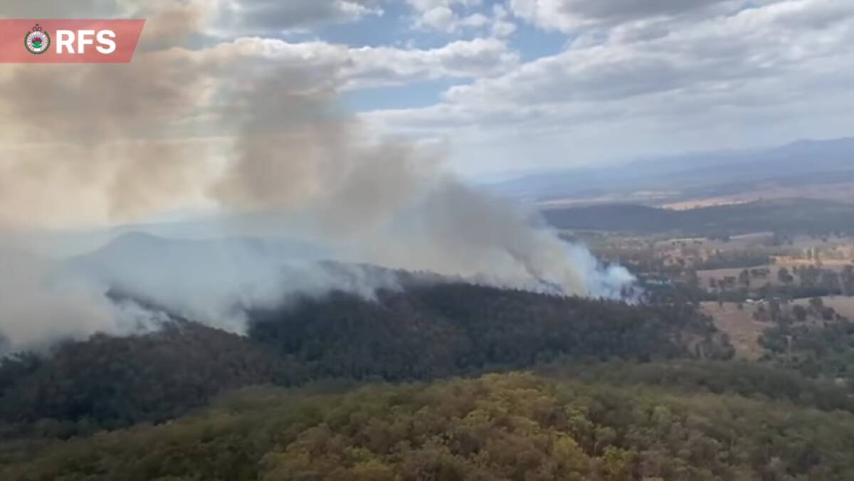 Firefighters took advantage of favourable weather condtions to undertake back burning operation at the Willi Willi Road Fire on Friday, October 20. Picture by RFS NSW