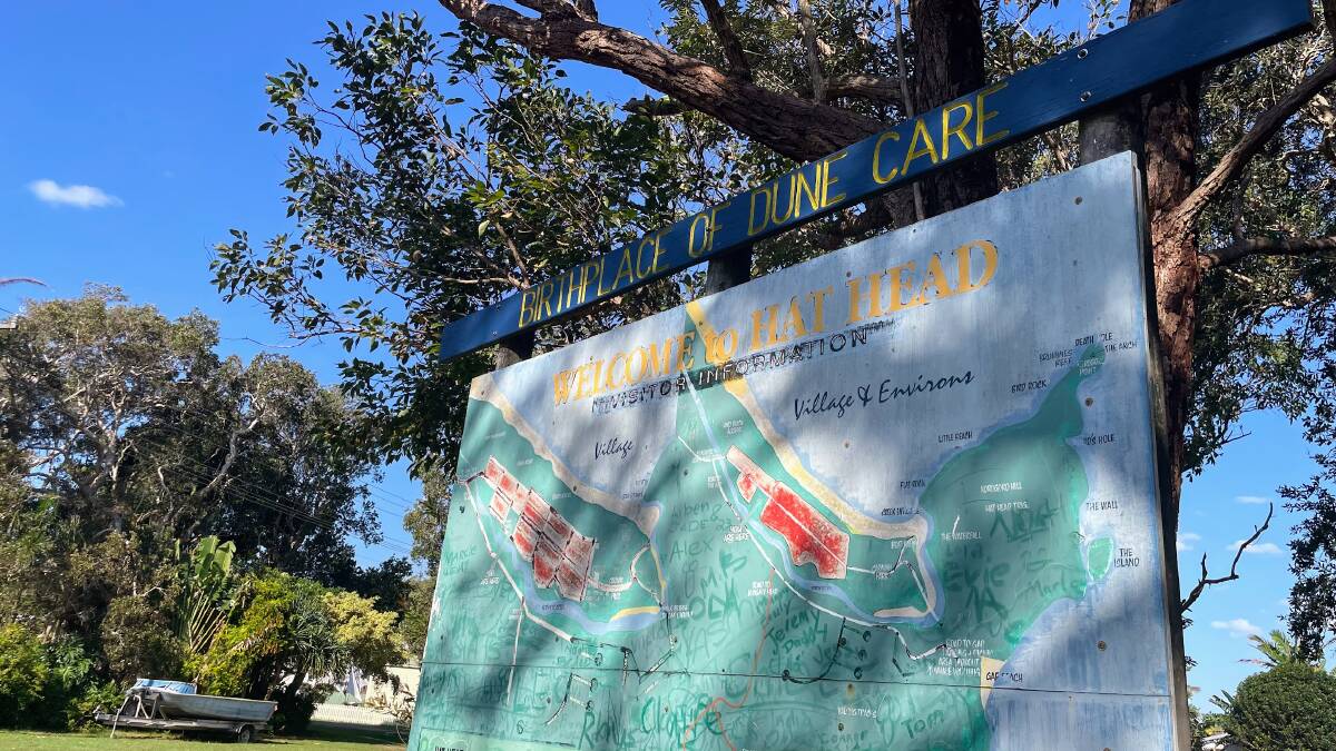 A sign above a map of the Hat Head proclaims it is 'The Birthplace of Dune Care'. Picture by Emily WAlker