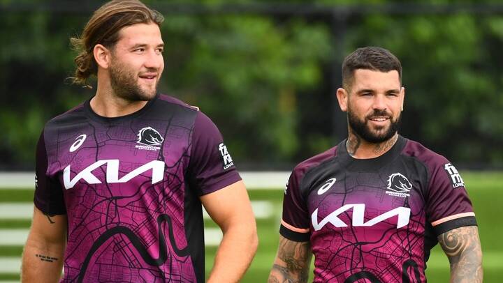 Broncos players Patrick Carrigan and Adam Reynolds look on during a Brisbane Broncos NRL training session at Clive Berghofer Field, in Brisbane, Tuesday, February 13, 2024. Picture AAP Image/Jono Searle