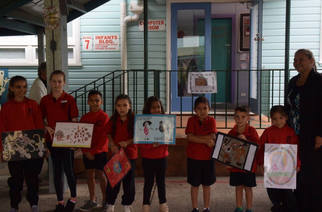 ART APPRECIATION: The students presented the elders with artworks to show their appreciation. Photo: Tom Bushnell.