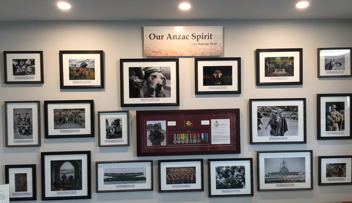 OUR ANZAC SPIRIT: The ANZAC wall at Macleay Valley House features a series of photographs of Australian service men, women and animals. Sourced from the collection at the Australian War Memorial, they span from Gallipoli to Afghanistan and across the three services. First World War nurses, young men of bomber command, infantry in Vietnam and sailors – all are reminders of what they and their uniforms represent – a life of value in the service of others and Australia. Combat engineers Sapper Darren Smith and ‘Herbie’ along with Jacob Moreland relaxing before the patrol that killed all three are among the images. 