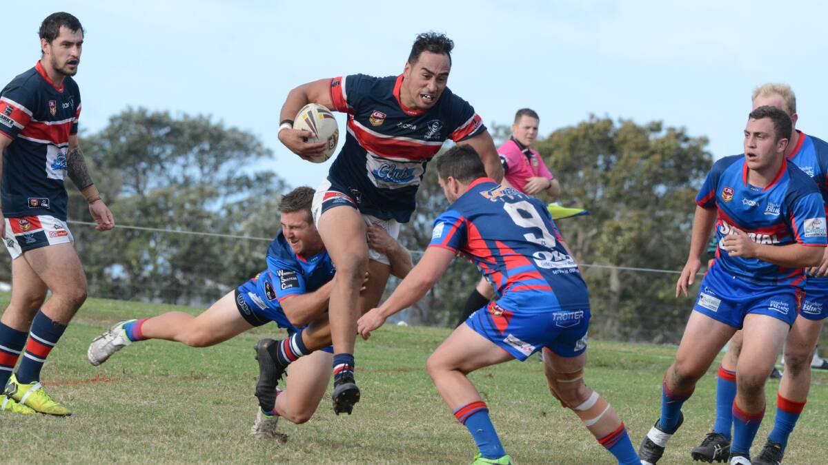 Out of the way: Old Bar second rower Carlos Kohu-Martin tries to crash his way through Wauchope defenders.