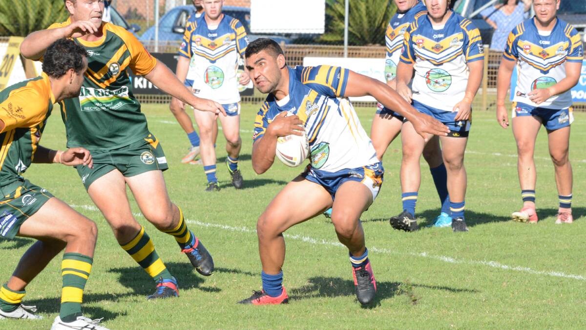 Macleay Valley captain Richie Roberts tries to evade Forster defenders during the Group Three Rugby League game at Tuncurry. Roberts played strongly in Macleay's 32-16 win.