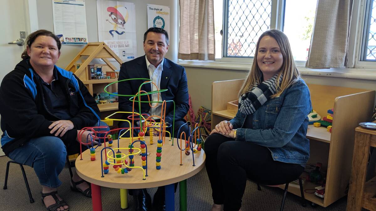 CHILD CARE SAFE: Kempsey In Home Care staff Kathi Preston and Nyree Simpson discuss the Federal Government funding which has saved their child care service with local MP Pat Conaghan
