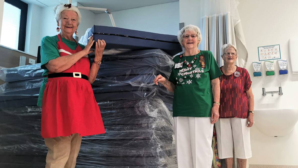 Kempsey UHA president Aileen Lewthwaite, Pat Major and Ruth Woodward with the new mattresses, made possible from the proceeds of the branchs craft sales and street stalls