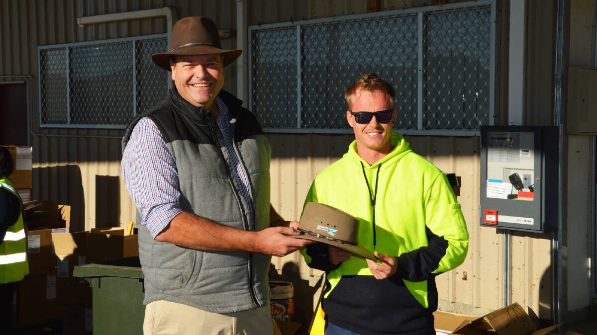 Akubra managing director Stephen Keir presents council employee Dean Notley with his new Cattleman