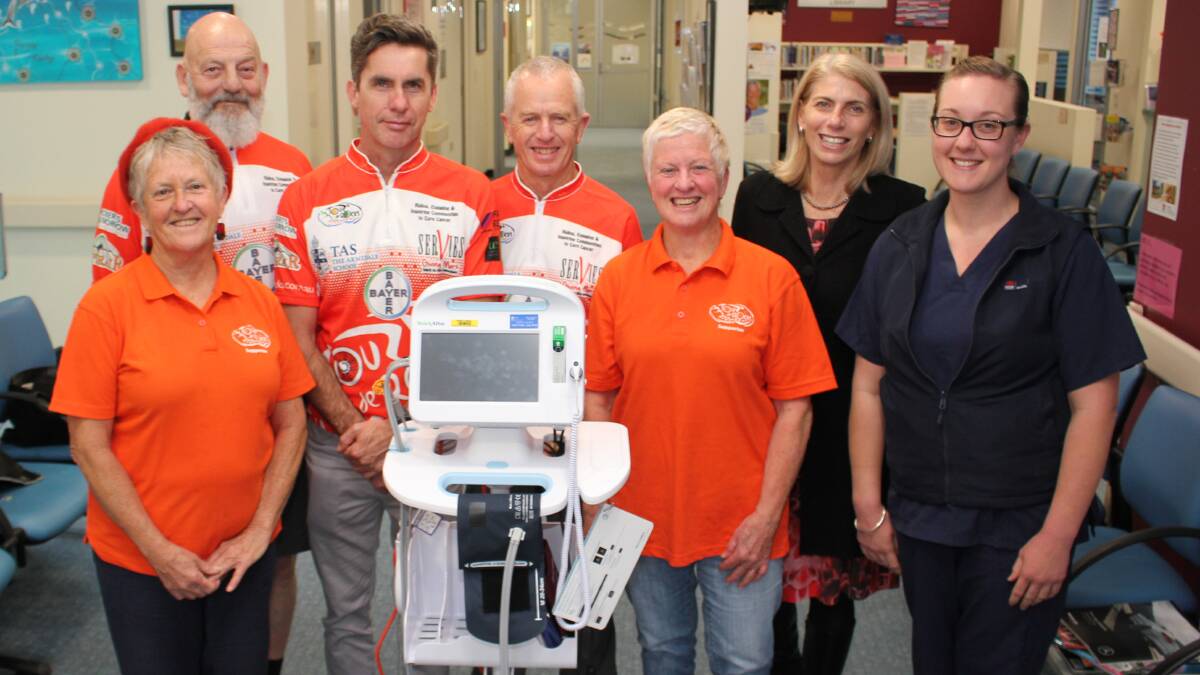 Vital donation: Jann Kesby (representing the Hat Head Tri Girls), and the Gordon Street Cycles team of Paul Bann-Murray, Ed Godschalk, Dave Anderson, Roz Anderson and Justeen Single with the donated vital signs monitor and a grateful MNCCI acting Nurse Unit manager, Katie Gooch