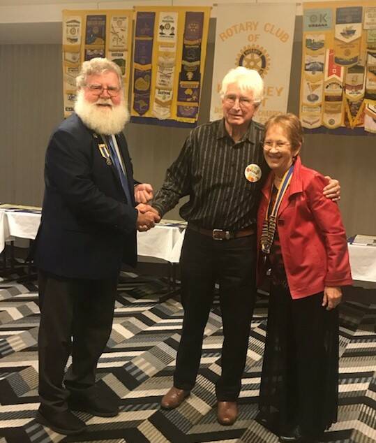 Rotary District Governor Phil Hafey, sapphire Paul Harris fellowship pin recipient Kevin Farrawell and Rotary Club of Kempsey West president Robin Norton