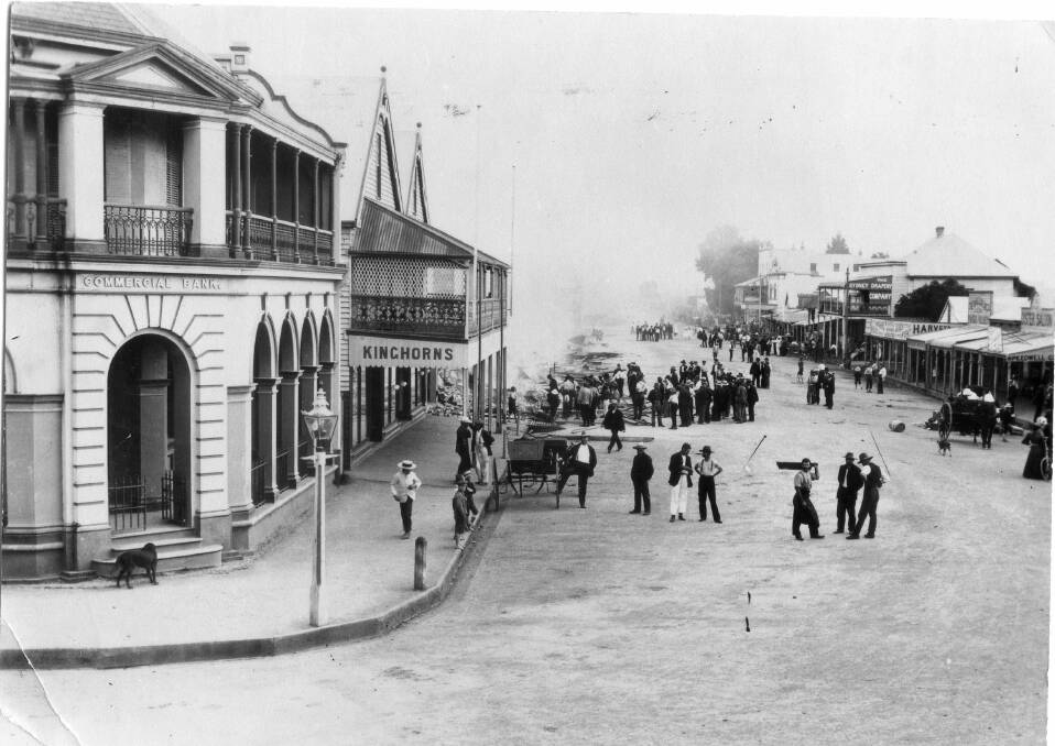 Townspeople gather in the street the morning following the disastrous fire (Pat Riggs Collection, MRHS)
