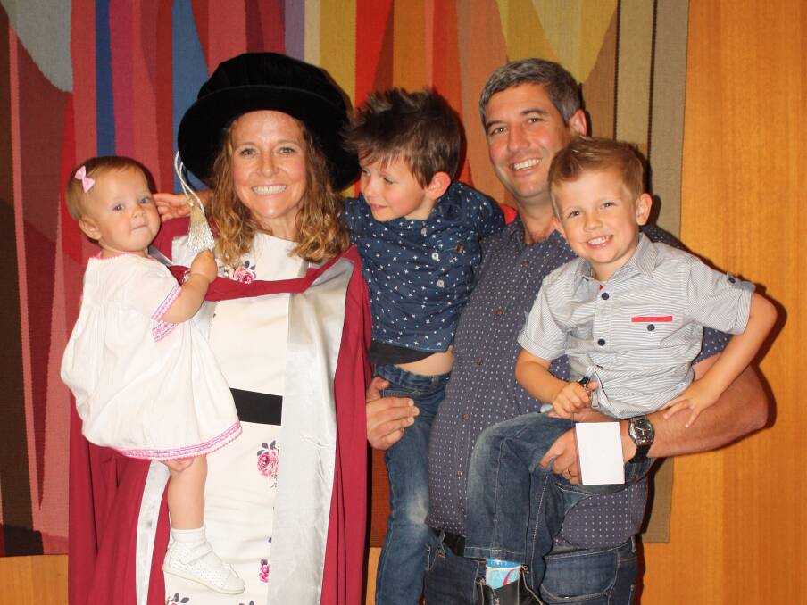 HAPPY CHAOS: Dr Katie De Luca with her husband, Troy, and children Ivy, Marcus and Alex on her graduation night.