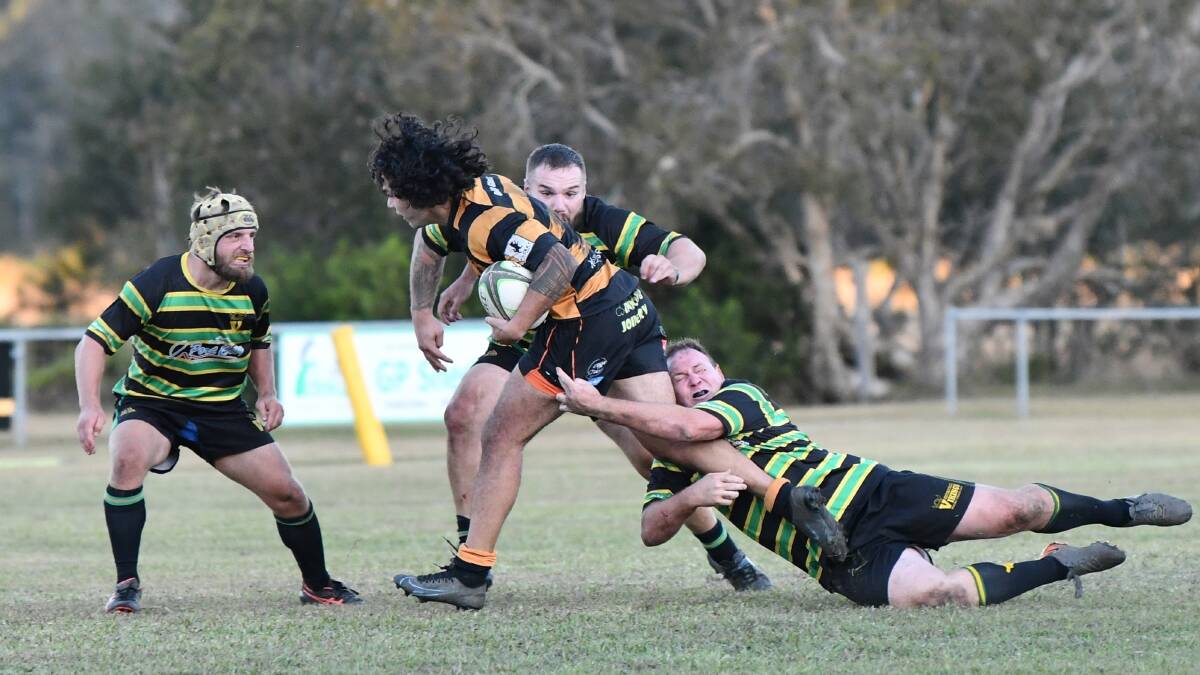 Iulio Tavete tries to break free of the Vikings defence. Photo: Penny Tamblyn