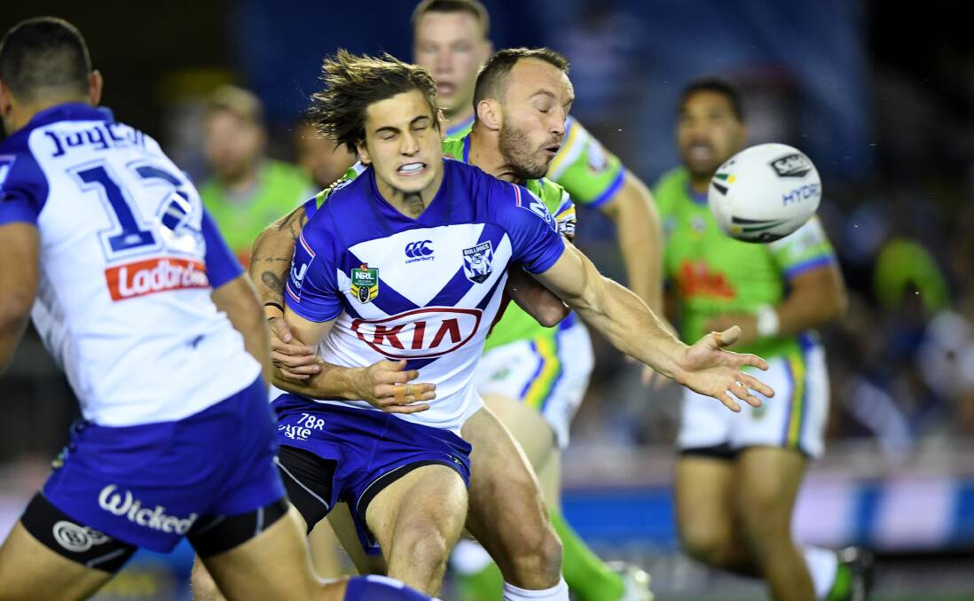 Back in town: Lachlan Lewis gets a pass away in a clash against Canberra. The two sides will play an NRL trial in Port Macquarie on February 29, 2020. Photo: NRL Photos/Gregg Porteous