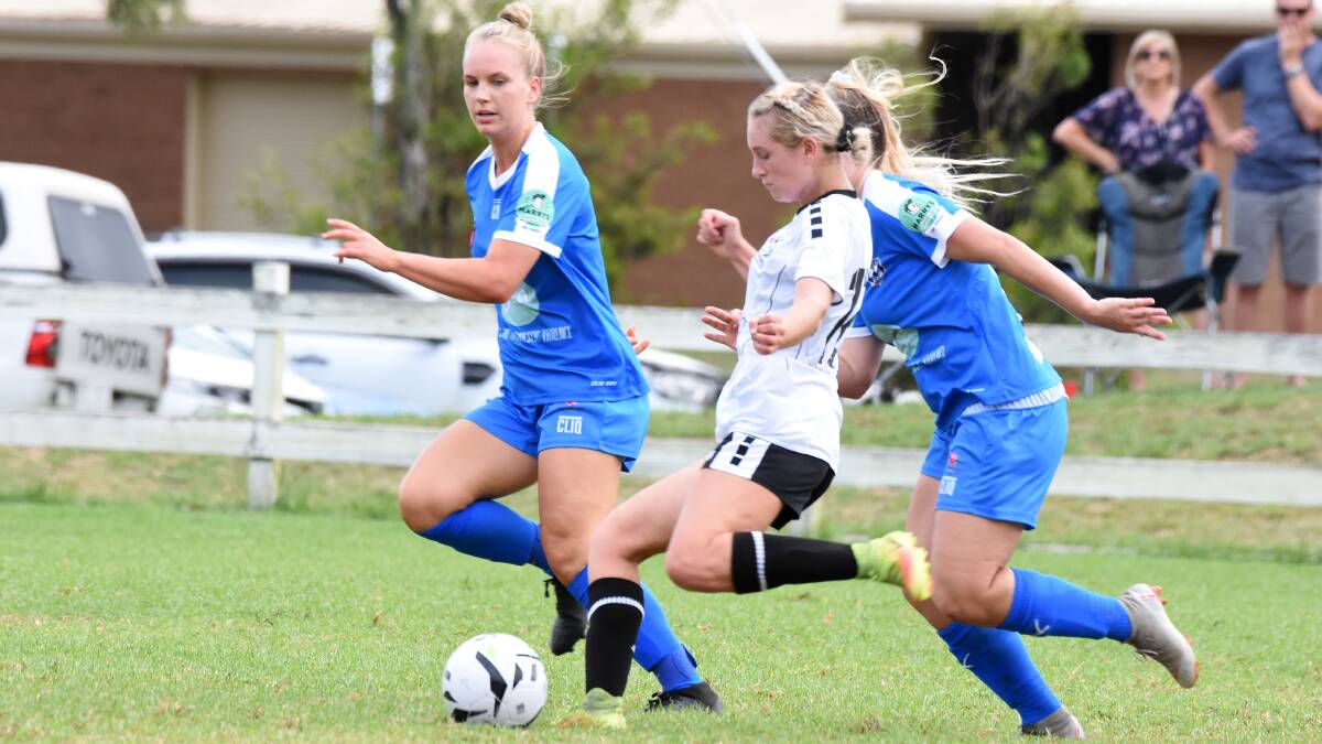 Hard at work: Port Macquarie's Layni Fens gets a pass away during Mid North Coast's round two WPL loss to New Lambton. Photo: Scott Calvin