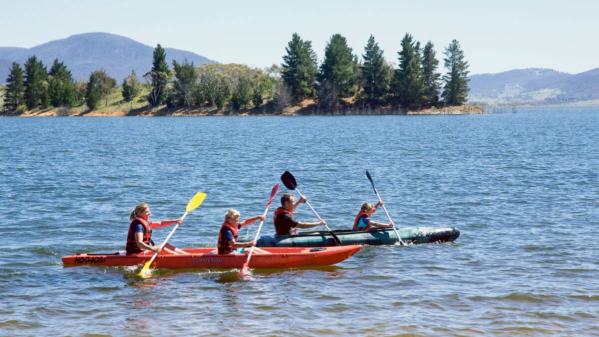 A scenic kayak on Lake Jindabyne in the Snowy Mountains is the perfect family day out. Picture: Destination NSW