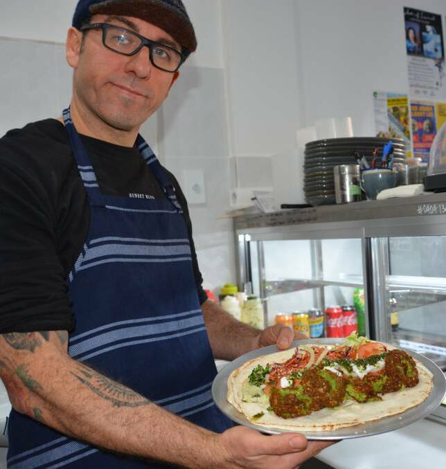 Fresh options: Josh Ireland with his vegetarian felafel kebab, Cedar Take-Away's best seller. 