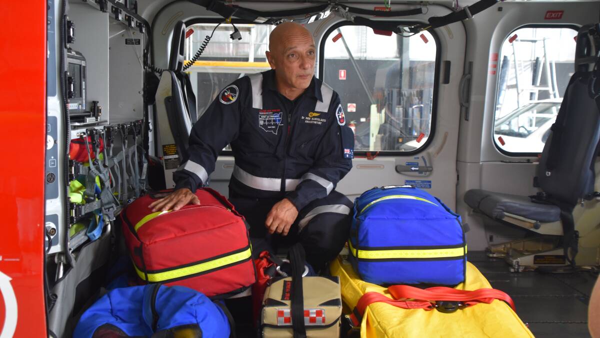 Dr Rob Bartolacci with some of the gear in the back of the chopper