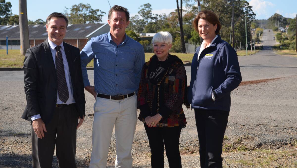 Kempsey Shire Council general manager David Rawlings, Federal Member for Cowper Luke Hartsuyker, mayor Liz Campbell and Member for Oxley Melinda Pavey stand on the dirt road that will soon become a major industrial thoroughfare 