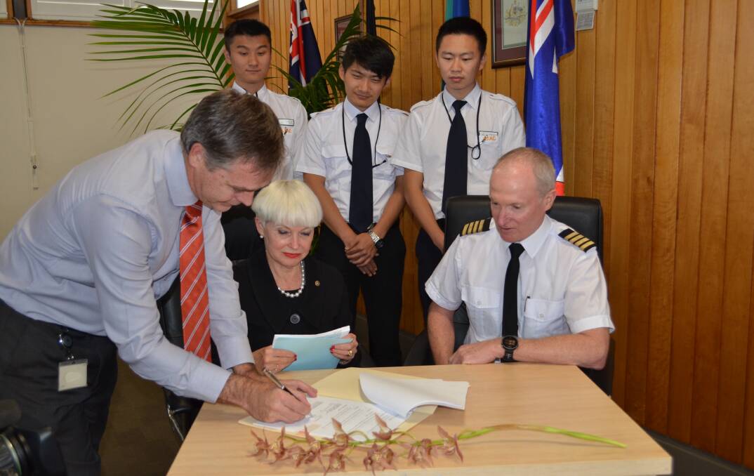 Kempsey Shire Council General Manager David Rawlings, Mayor Liz Campbell, Australian International Aviation College chief flying instructor and assistant general manager Kevin McMurtie with three pilot's in-training