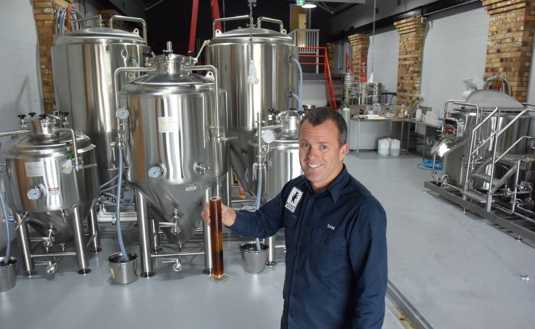Taste test: Kempsey's Sam Preston at the newly renovated Bucket Brewery in South Kempsey. Photo: Lachlan Leeming.
