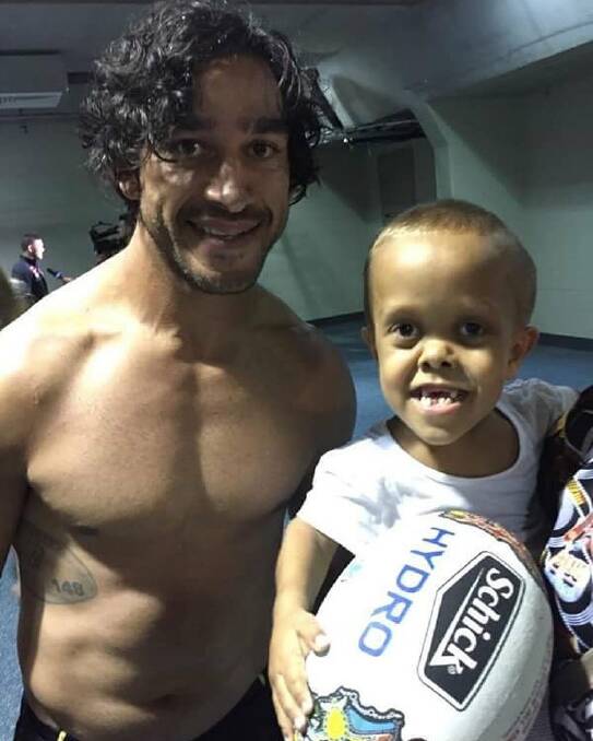 Good company: Quaden with NRL Cowboys star Johnathan Thurston after the 2017 Indigenous All Stars match. Photo: Supplied.
